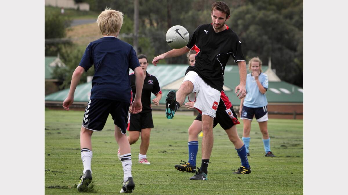 Josh Kennedy with local soccer youngsters at Glen Park in 2011.
