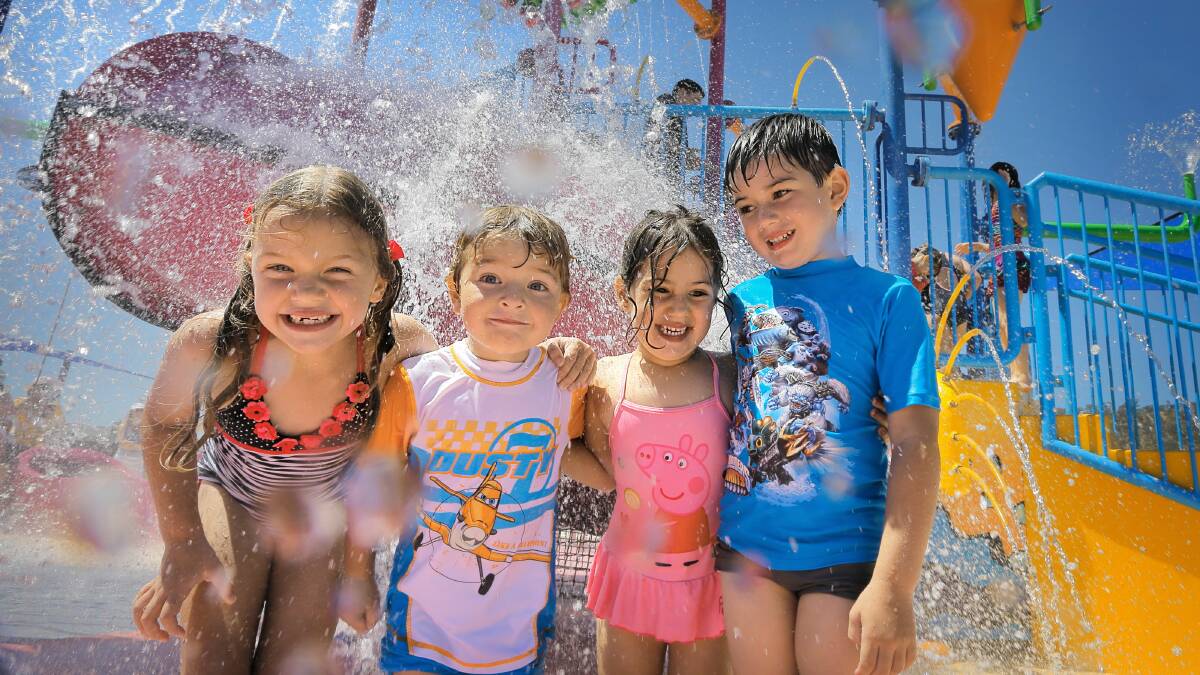 Cousins Ebony Banks, 6, Oliver Banks, 3, Siarna Martino, 3, and Anton Martino, 5, enjoyed cooling off under the big splashes at the WAVE pool. Pictures: TARA GOONAN