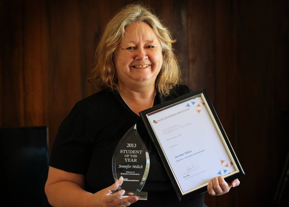 Jenny Milich shows her Student of the Year award after gaining distinctions in business administration at Albury TAFE. Picture: MATTHEW SMITHWICK 