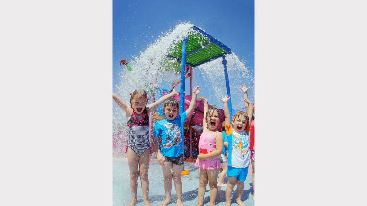 Cousins Ebony Banks, 6, Oliver Banks, 3, Siarna Martino, 3, and Anton Martino, 5, enjoyed cooling off under the big splashes at the WAVE pool. 