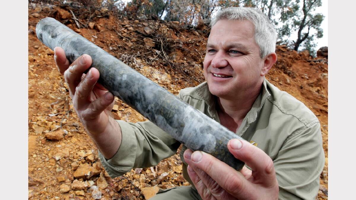 Field operations manager Murray Holland held up a core sample in 2010.