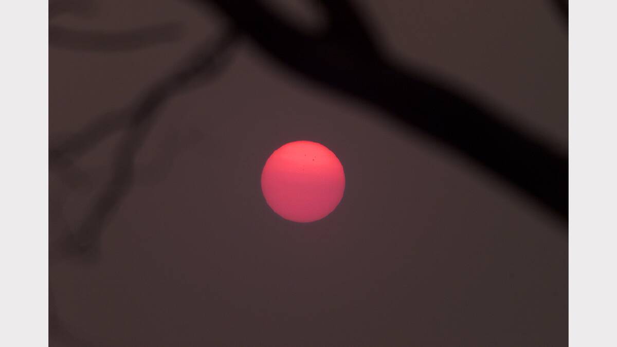 2003 January - a fiery red sun due to smoke from North East fires