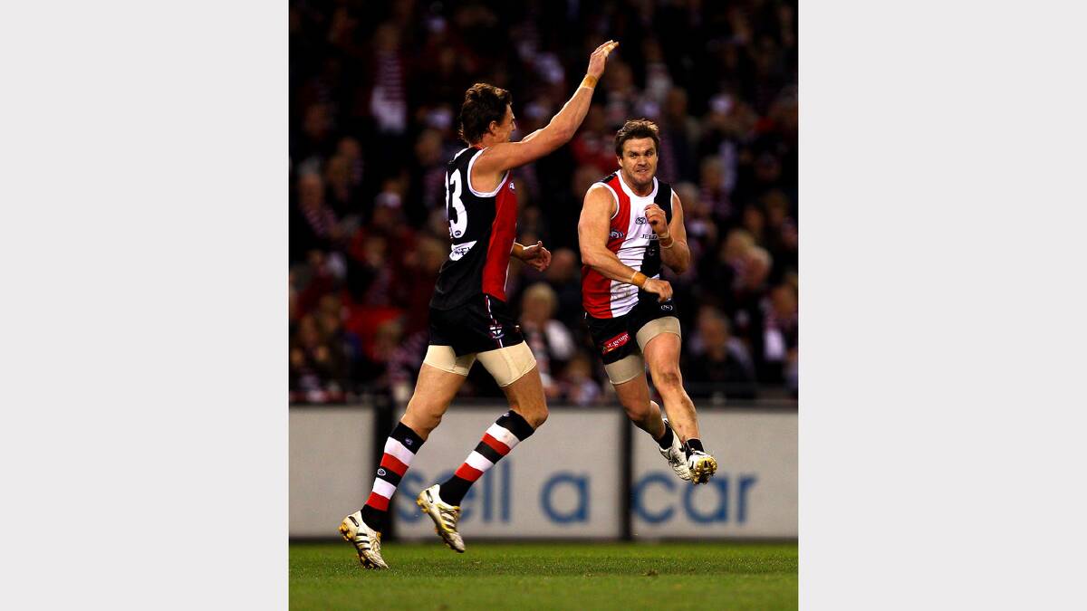 Adam Schneider of the Saints celebrates a goal with Justin Koschitzke during the round 17 AFL match between the St Kilda Saints and the Hawthorn Hawks. (2010) Picture: GETTY IMAGES