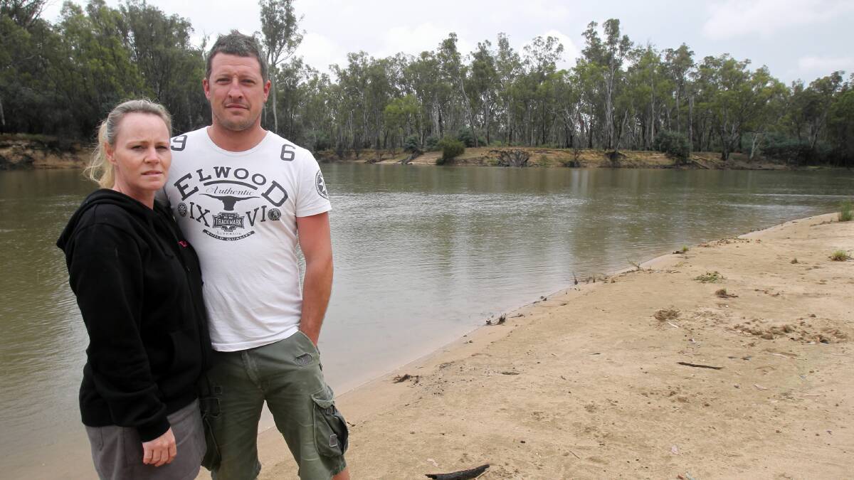  Partners Tracey O'Connor and Ryan Coldhill, from Point Cook Melbourne, where staying by the Murray River just down from where the body was located this morning. Picture:  MARK JESSER