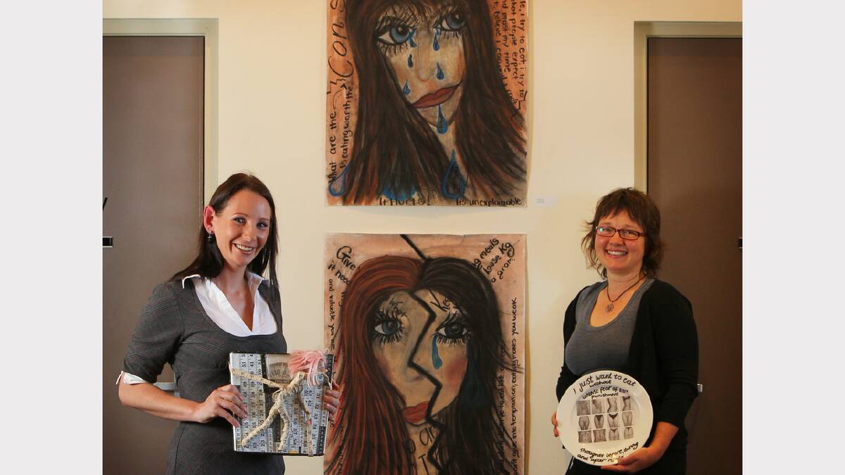 Eating Disorder Awareness Group member Sherylin Jones and facilitator Kim Haebich are hoping to eliminate the stigma that comes with an eating disorder through the art works of people affected. Picture: MATTHEW SMITHWICK