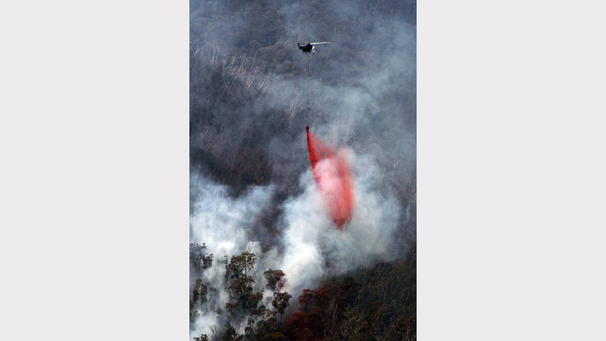 2013 January - Fire bombers dump retardant on a fire between Harrietville and Mount Hotham