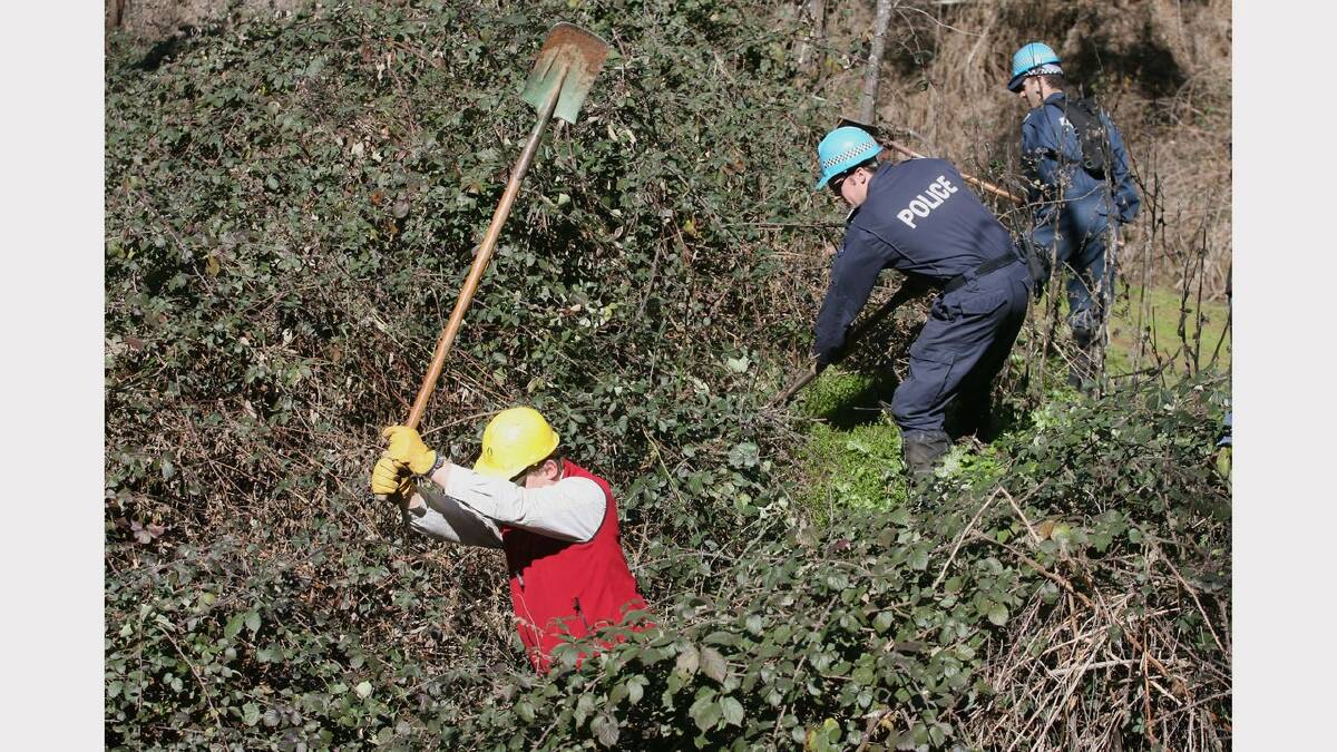 2007 -  Day 3 of a week-long search for Daniel Thomas. Police searching in black berries after finding a nappy near by.    