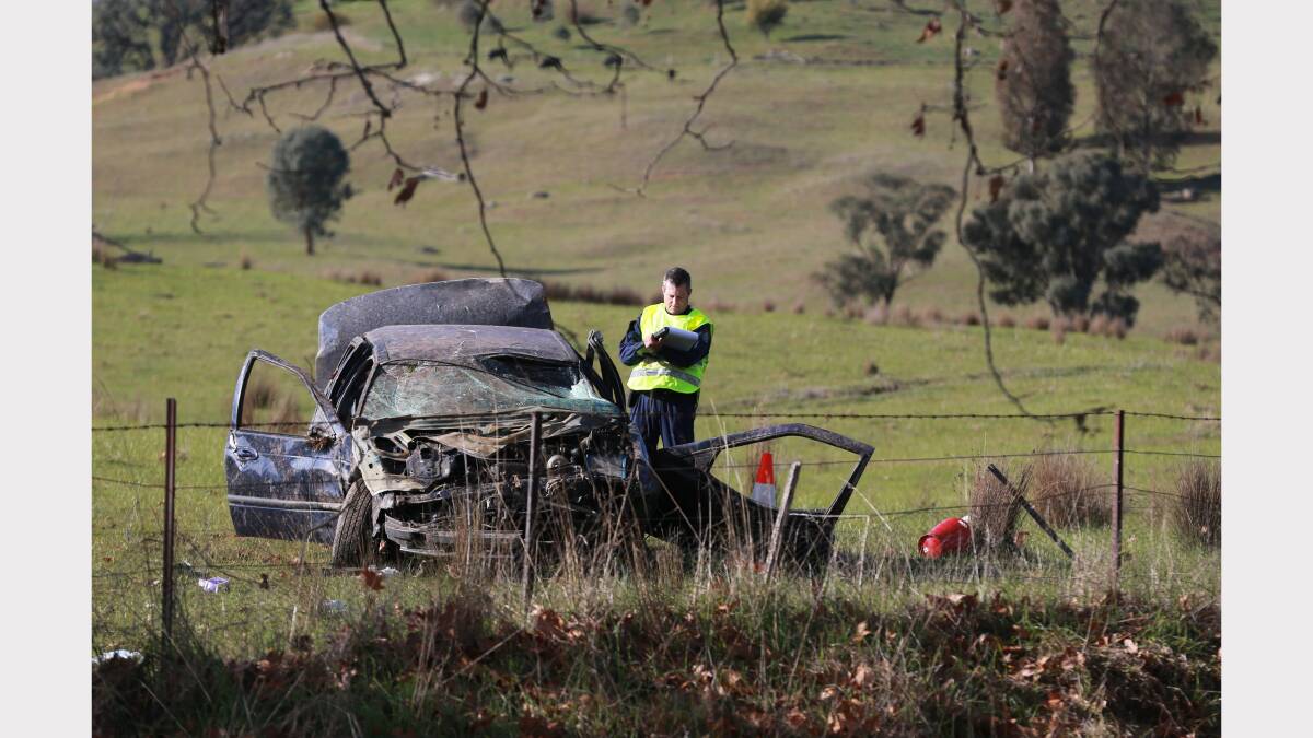 Police investigate the scene of an accident where four men were injured. Pictures: JOHN RUSSELL