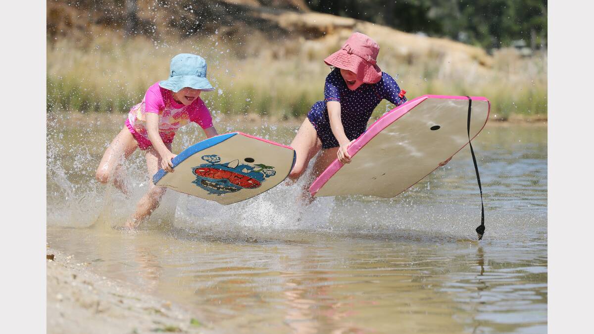 Sisters Clare,and Annabele Martinae, aged 7 and 10, race each other at Lake Sampbell, at Beechworth. 