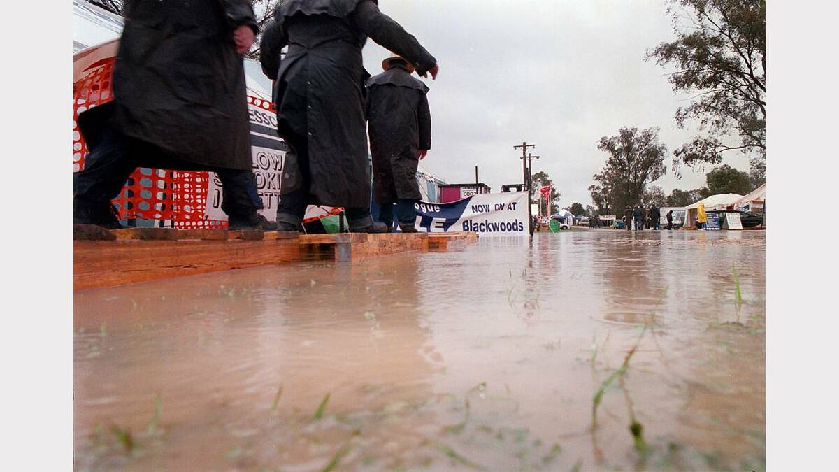 1998 - Henty Field Days. Visitors had to walk on planks to visit each stall.