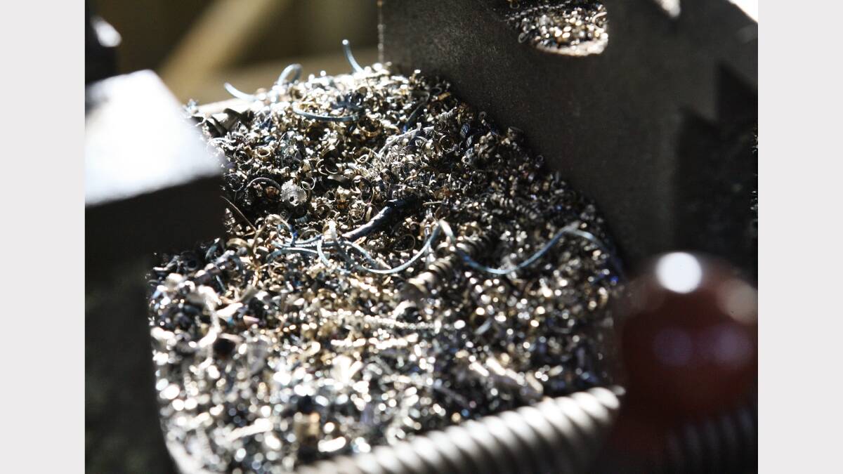 13. Metal shavings collect in piles under machinery. Picture: BEN EYLES