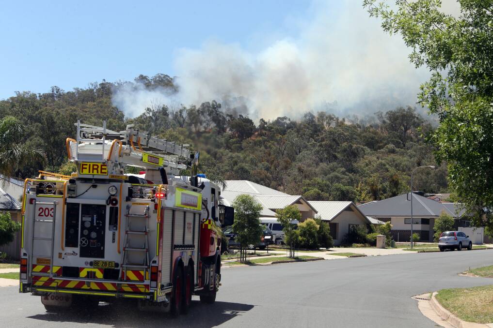 Fire crews make their way to the scene of blaze at Nail Can Hill. Picture: PETER MERKESTEYN