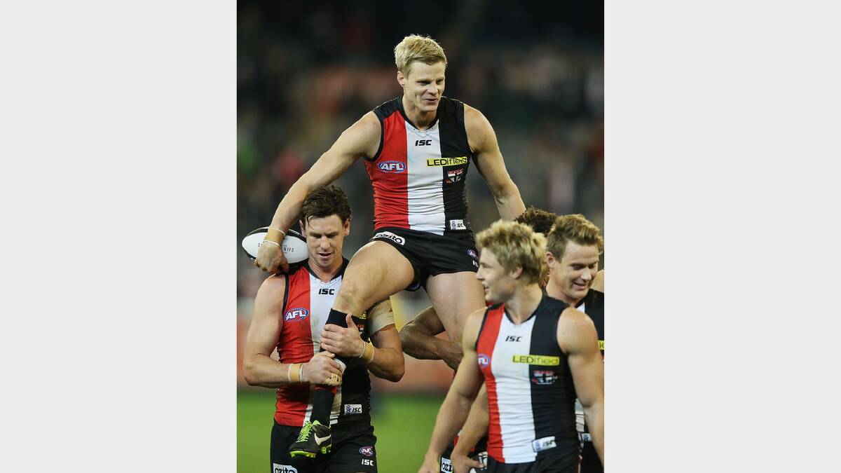 Nick Riewoldt gets carried off by Justin Koschitzke after his 250th game during the round 13 AFL match between the St Kilda Saints and the Melbourne Demons. (2013) Picture: GETTY IMAGES