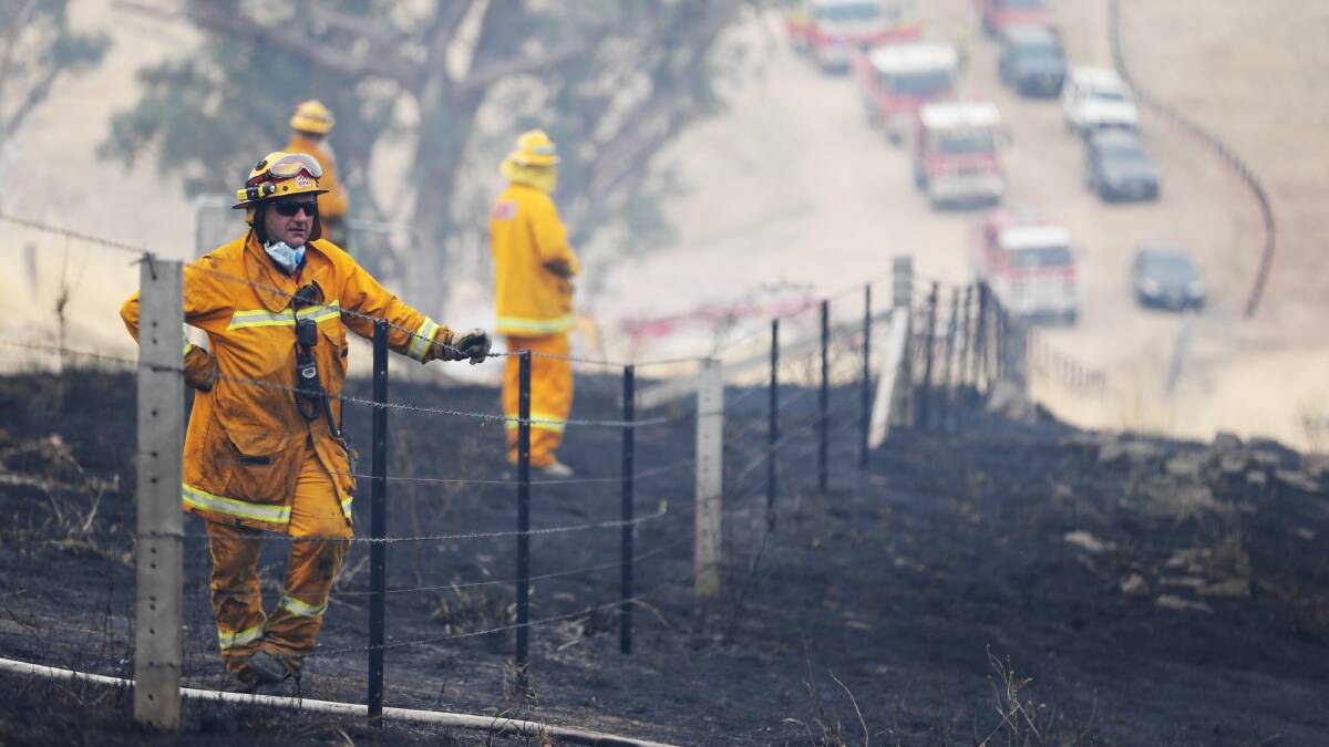 Firefighters at the Huon Hill grass fire. Pictures: JOHN RUSSELL