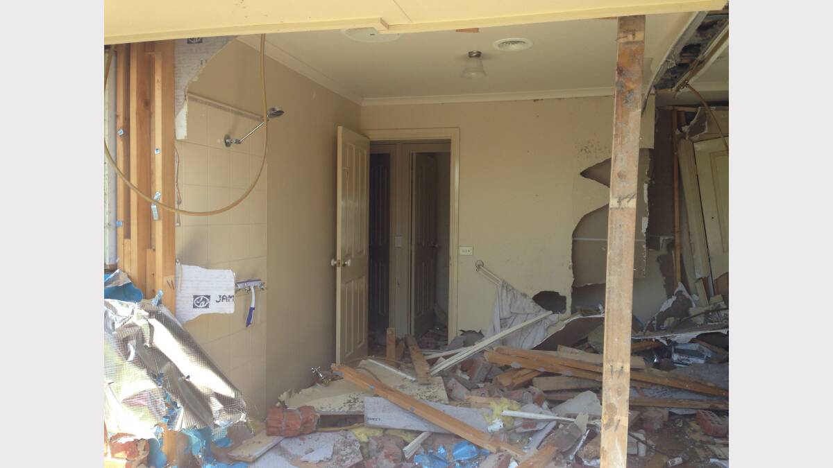A bathroom, wine cellar and part of a lounge room was completely destroyed after the LandCruiser ploughed into this house. 