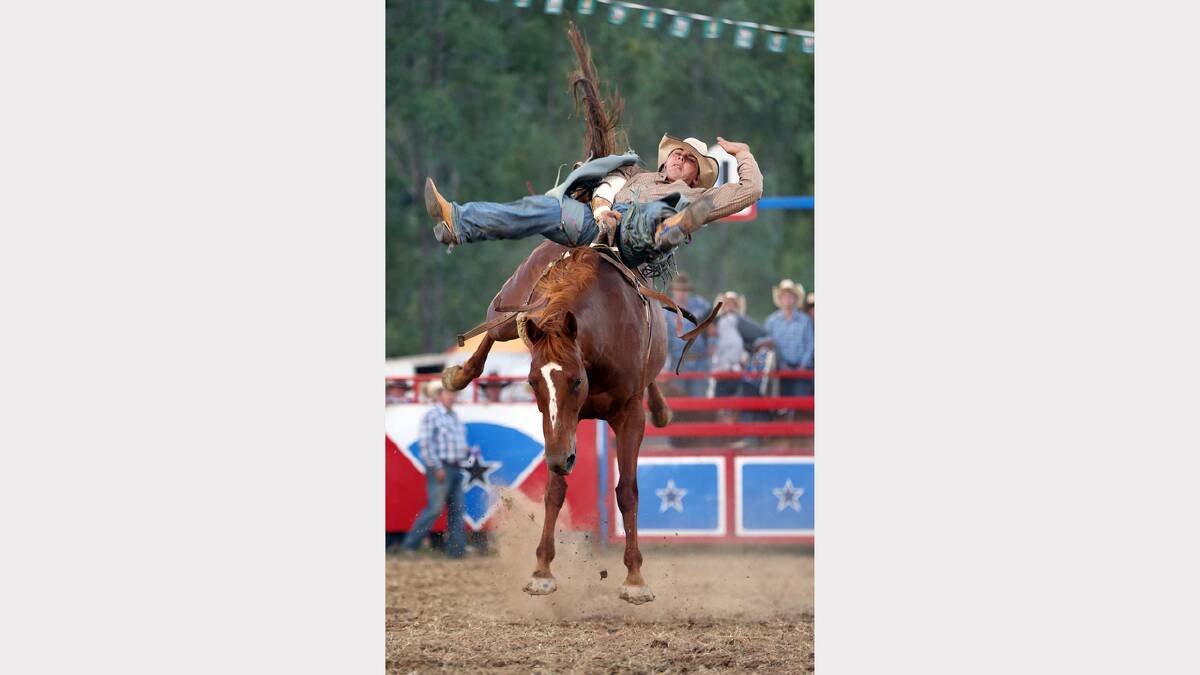 2012 - Brock Mulhall hangs on during the Bare Back Bronc Riding competition.