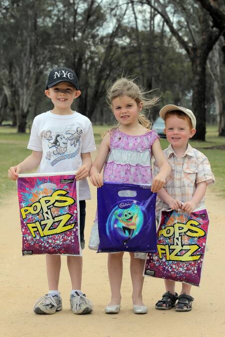 The Norman siblings Charlie, 7, Elise, 5, and Dusty, 3,all got a showbag to take home.