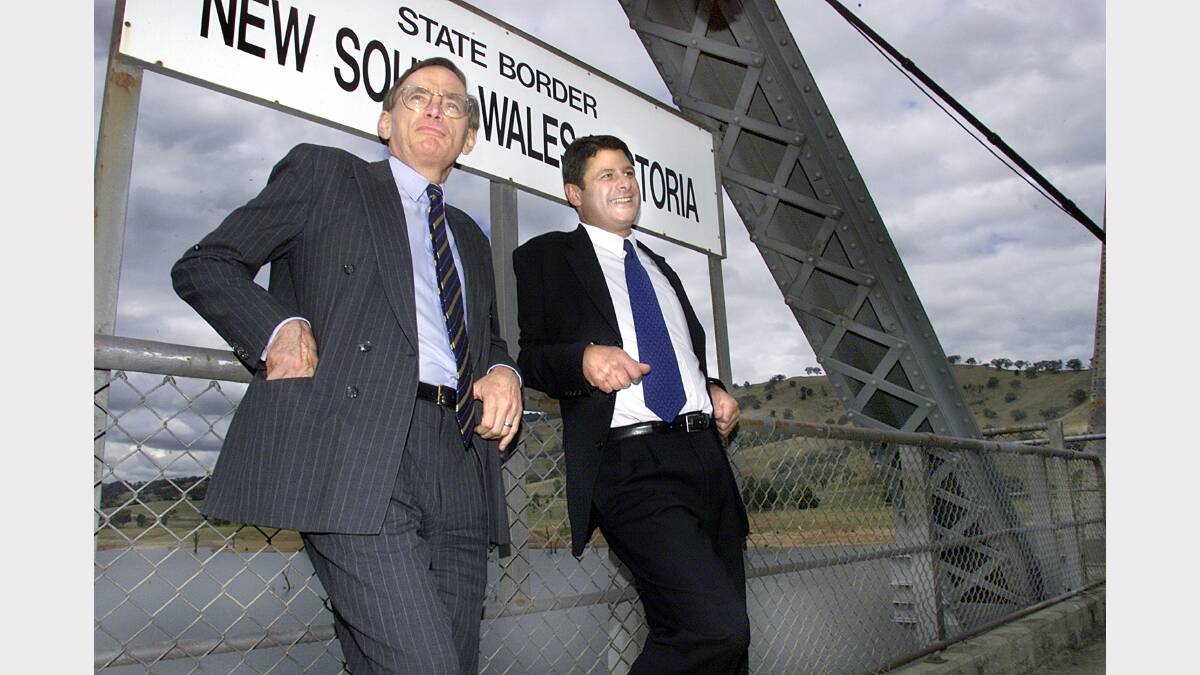 2001 - NSW Premier Bob Carr and Victorian Premier Steve Bracks pictured on the state borders at Bethanga Bridge.