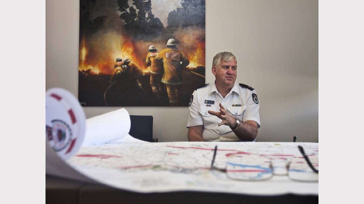 RFS superintendent George Alexander on his last day on the job. Eyles had put his work gear away and was snapping with a smaller, quieter camera. “This was after we had done the photoshoot and we were just chatting,” he says. “It ticks all the boxes because you can see the map, logo, artwork of firefighters and George Alexander himself.”