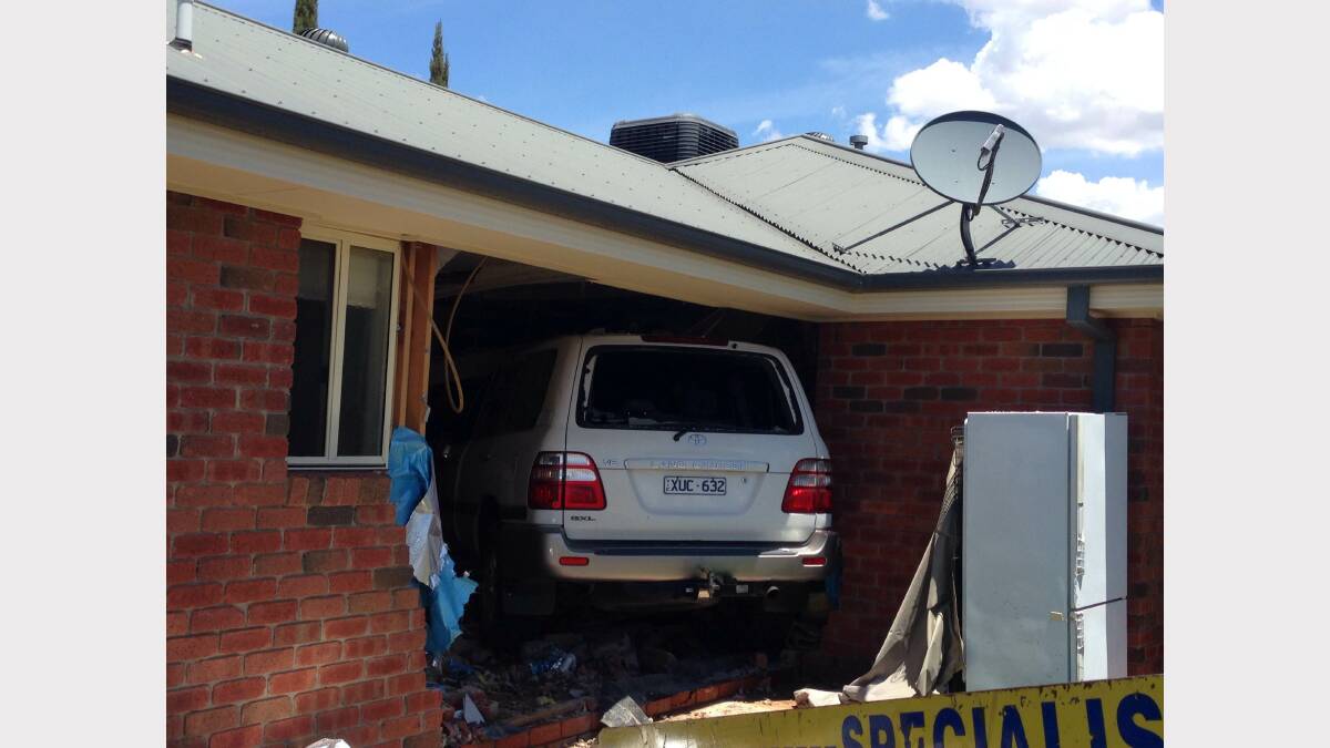 The car smashed through the bathroom wall of the house. 