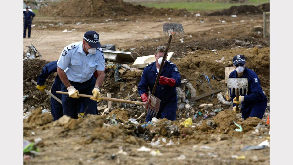 2003 - Police dig through incoming rubbish at the tip as they search for missing toddler Daniel Thomas, 2. Picture: NEWS LTD