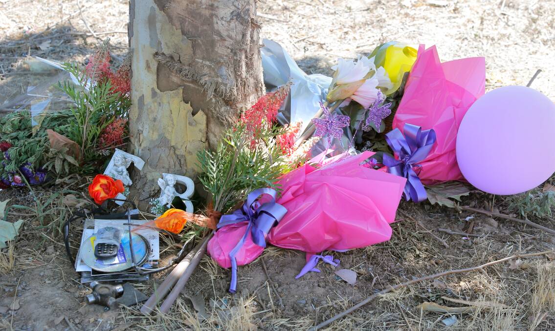 Flowers at the scene of Friday’s fatal crash.