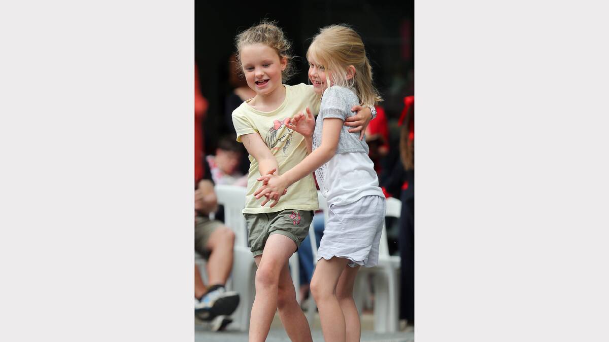 Ella Bradley, 8, and Mia Johnson, 6, dance at the Reid Street Community Stage. Pictures: JOHN RUSSELL 