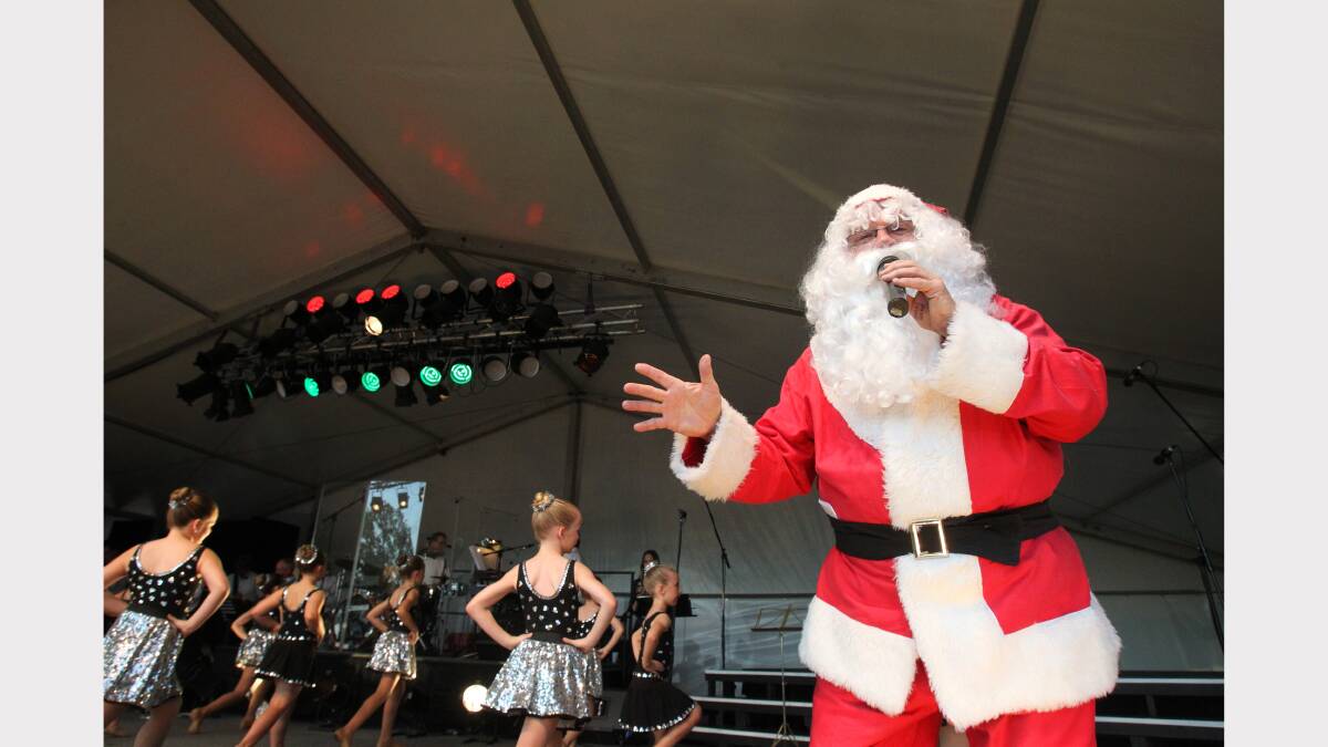  Santa performs for the crowd. 