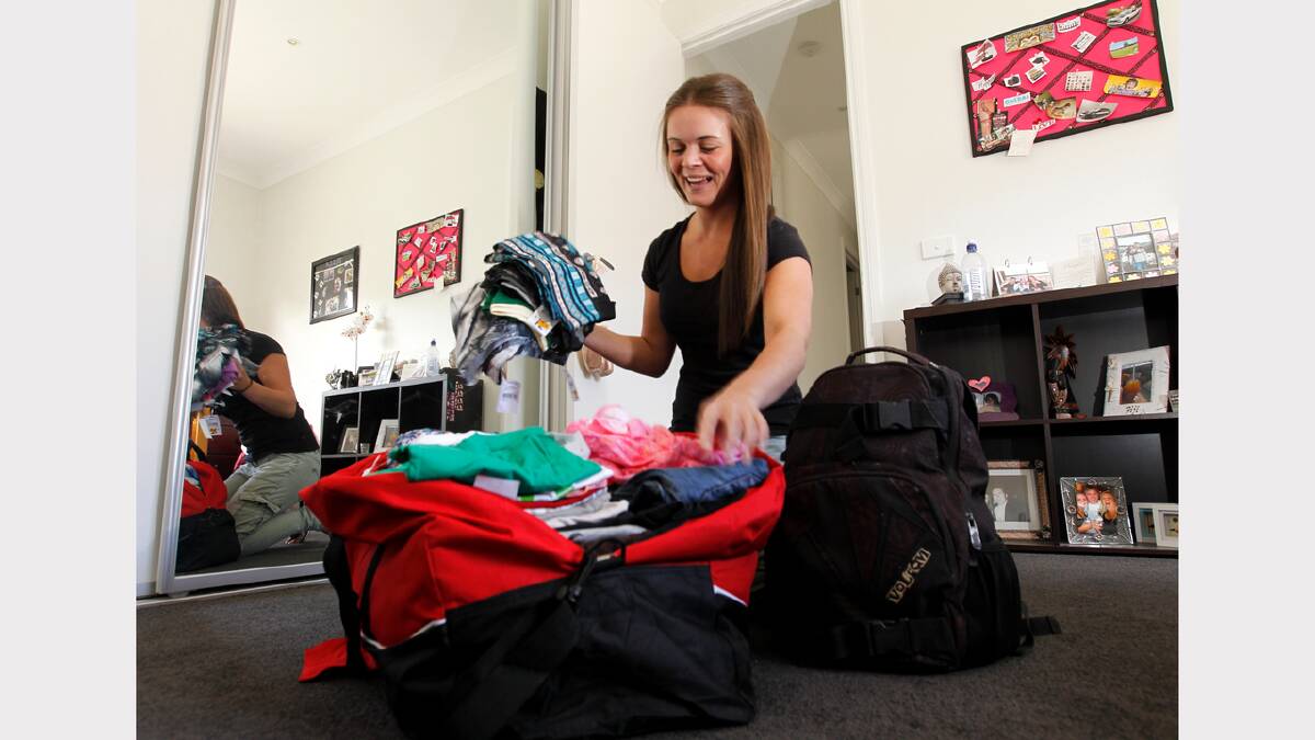 Stevie Smith packs her bag in preparation to help the victims of Super Typhoon Haiyan.