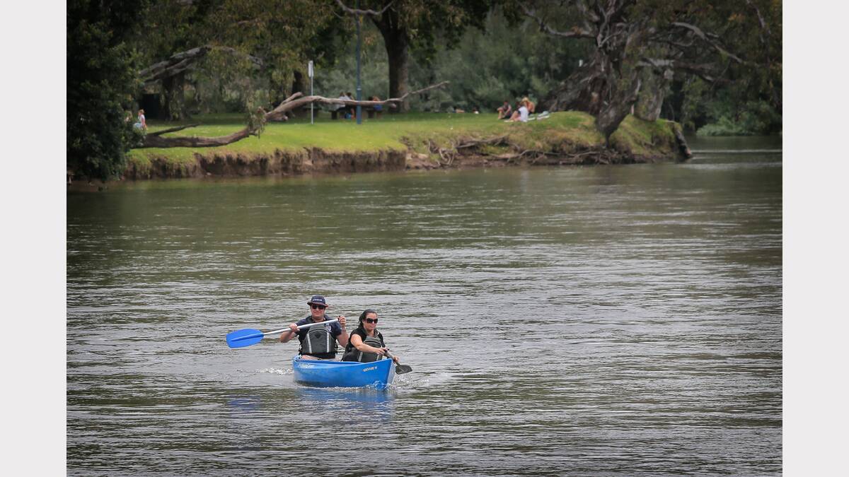 Wodonga's Dr Jonathan Lewin and Linda Lewin take a casual paddle in canoes from Murray River Canoe Hire. 