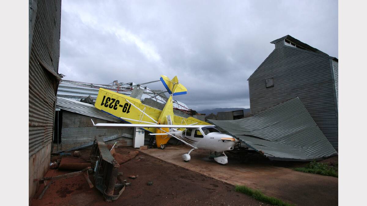 A plane is torn from its hanger in Myrtleford. June, 2010.