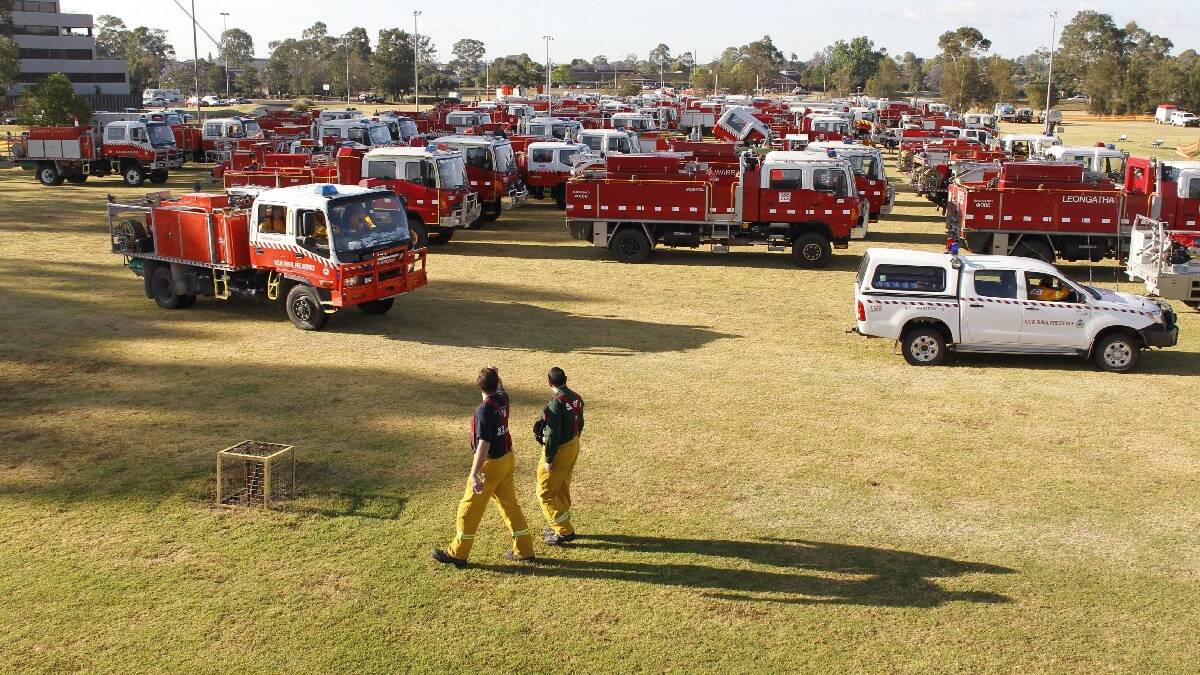 RFS and interstate firefighters muster at the Penrith Base Camp before deployment to the fireground on Wednesday. Picture: Andrew Meares