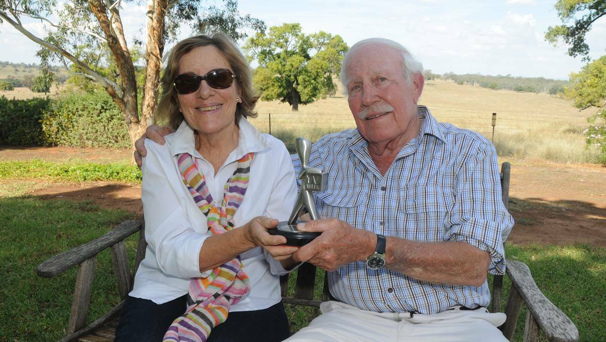 Sylvia and Gareth Peacocke at their Dubbo property with Logie winner son Steve's first Logie. The family will now have two to sit on the mantlepiece. Photo: AMY MCINTYRE