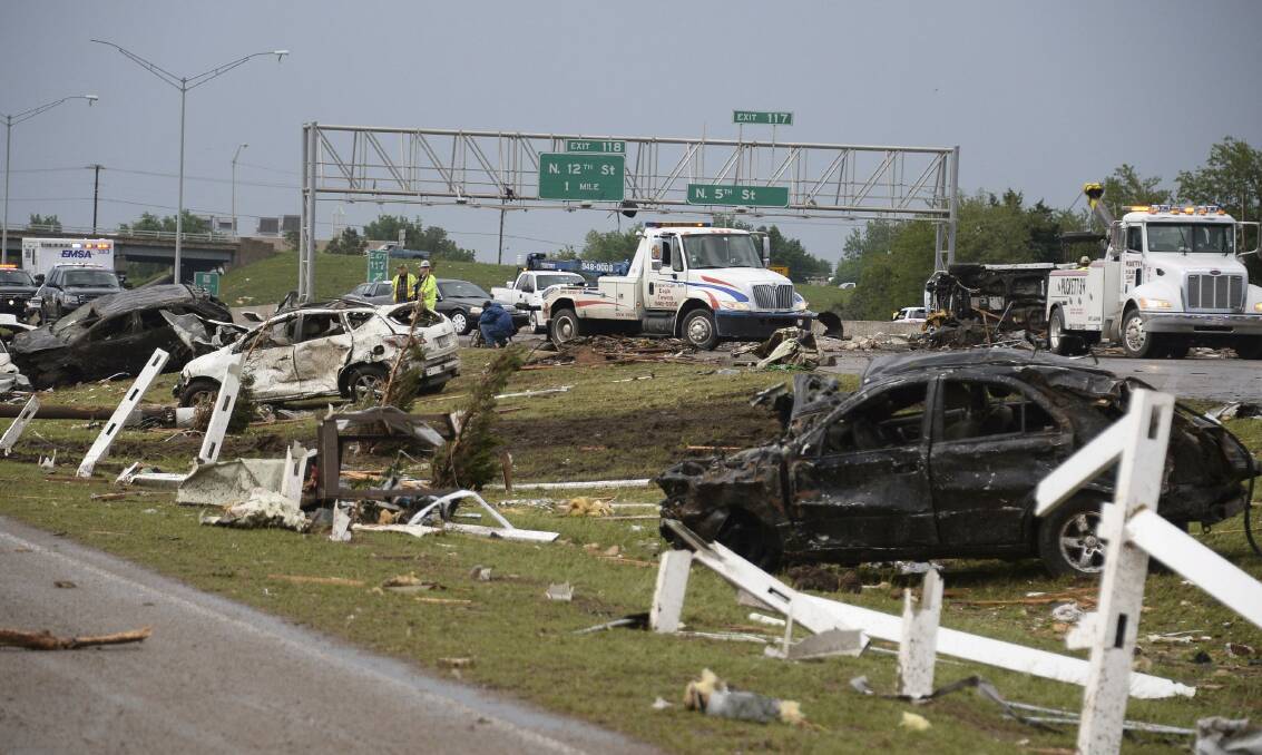 Destroyed cars are seen along Interstate 35 after a tornado struck Moore, Oklahoma, May 20, 2013. Photo: REUTERS/Gene Blevins