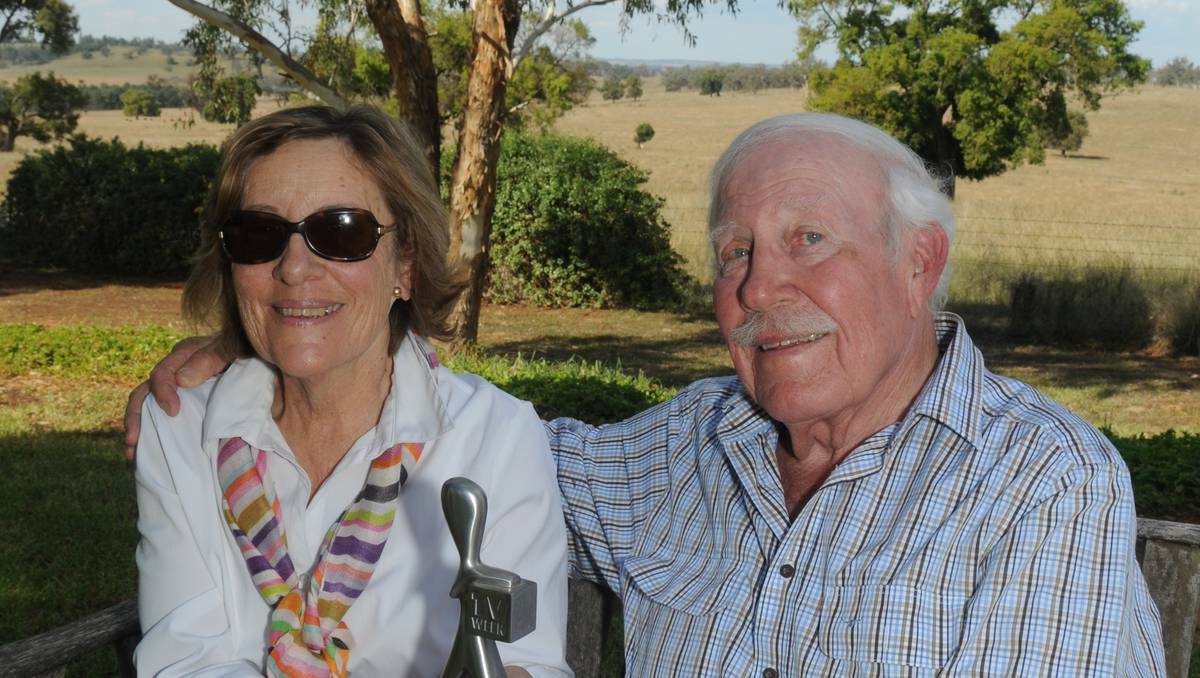 Sylvia and Gareth Peacocke at their Dubbo property with Logie winner son Steve's first Logie. The family will now have two to sit on the mantlepiece. Photo: AMY MCINTYRE