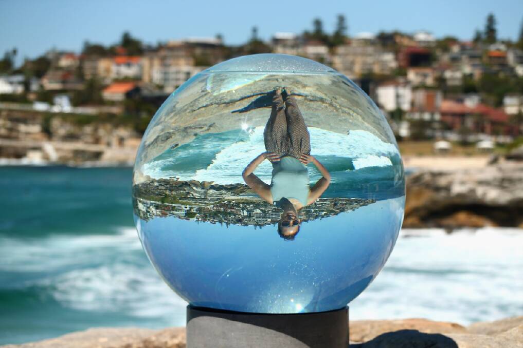  Artist Lucy Humphrey poses behind her sculputure 'Horizon' during the 2013 Sculptures by the Sea exhibition at Bondi on October 24.  (Photo by Cameron Spencer/Getty Images)