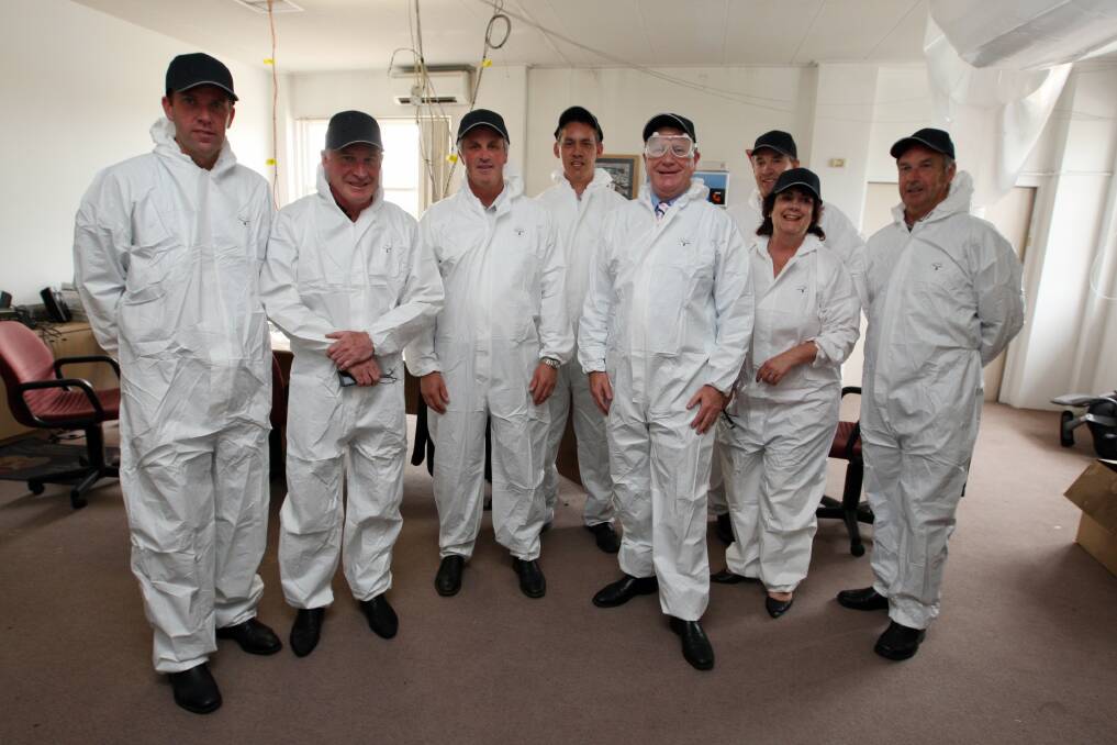 Denis Napthine and south-west leaders suit up to enter the Telstra exchange.