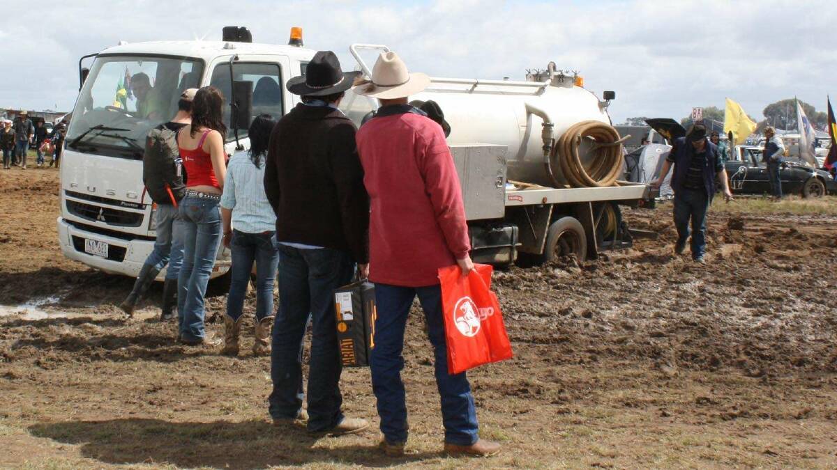 2011: Muster-goers watch on as a water truck gets stuck. Picture: Lily Huntly