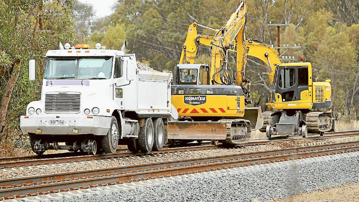 Heavy machinery is put to use during track maintenance on the railway line west of Wodonga.