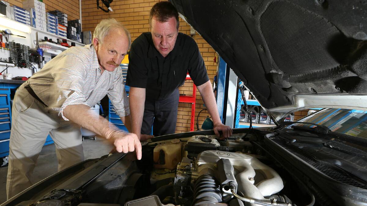 Owen Stickels, left, and Darren Mitchell look over Stickels’ BMW 318i. Picture: KYLIE ESLER