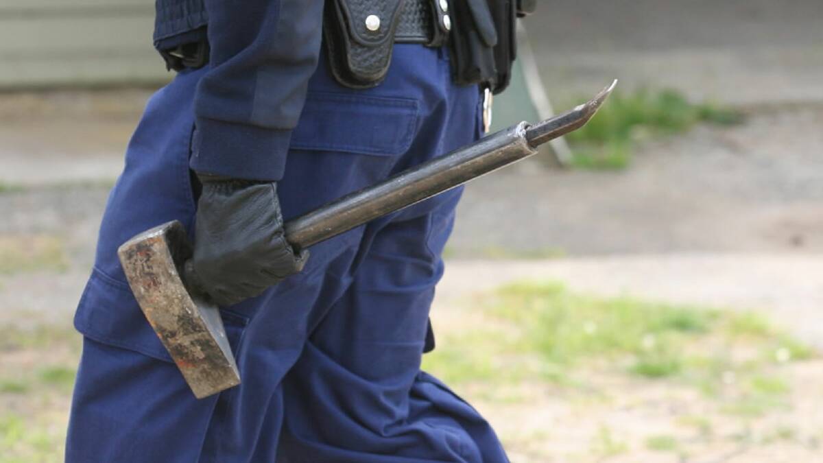 A sledgehammer used to break into a suspect’s car during yesterday’s raid by police. Picture: BEN EYLES