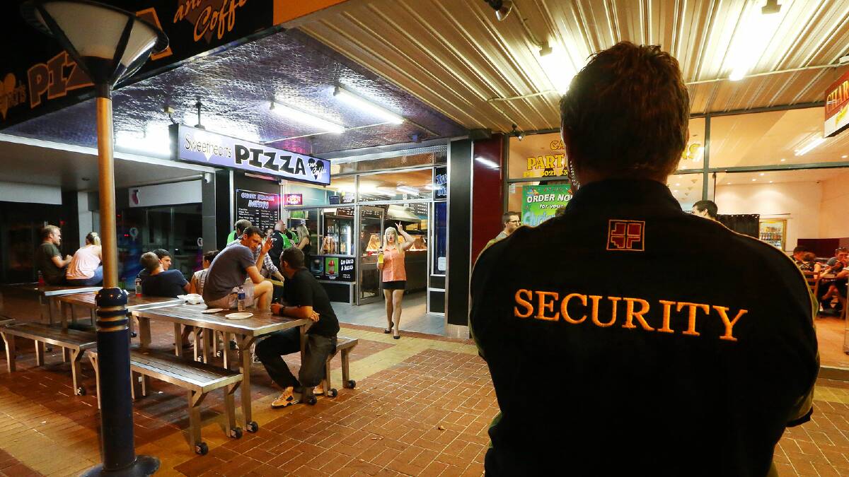 Security from nearby nightspots keep an eye on the revellers at Sweethearts Pizza. Picture: JOHN RUSSELL
