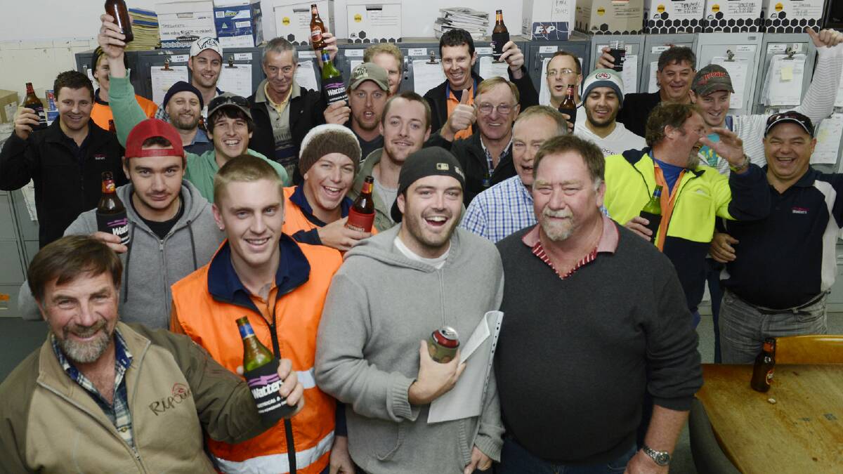 To the rescue: new owner Robin Knaggs, front, far right, with his workforce. Mr Knaggs sold Watters to Hastie in 2007 but has come back to save the Shepparton office. Picture: SHEPPARTON NEWS