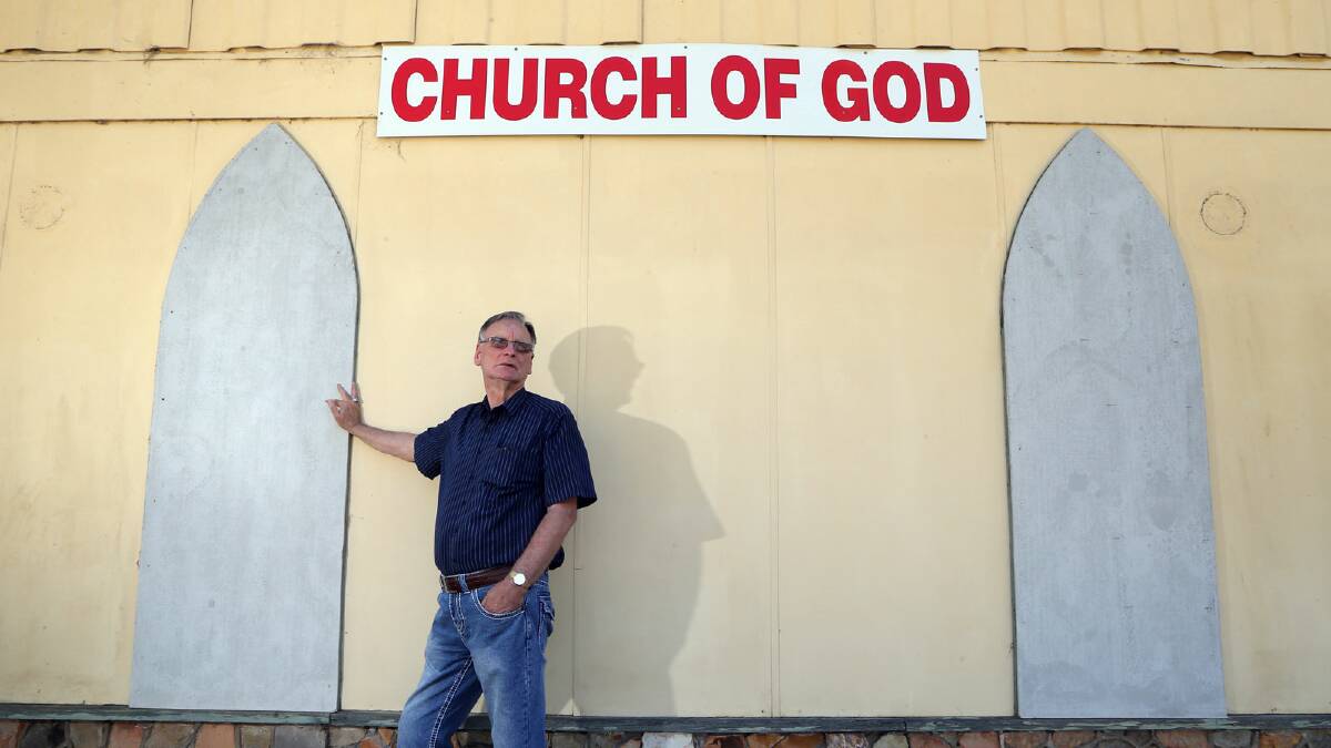 Pastor Philip Morton has taken to boarding up the church windows after a spate of thefts. Picture: KYLIE ESLER