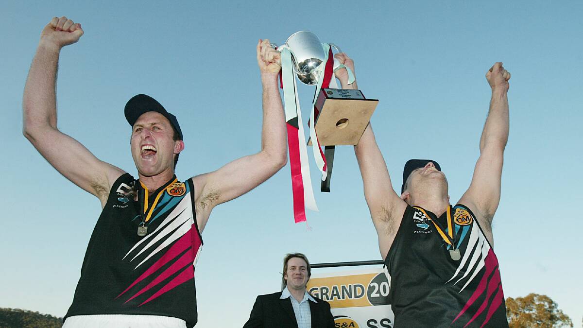 Tim Sanson and Darryn McKimmie celebrate the 2005 premiership win.
