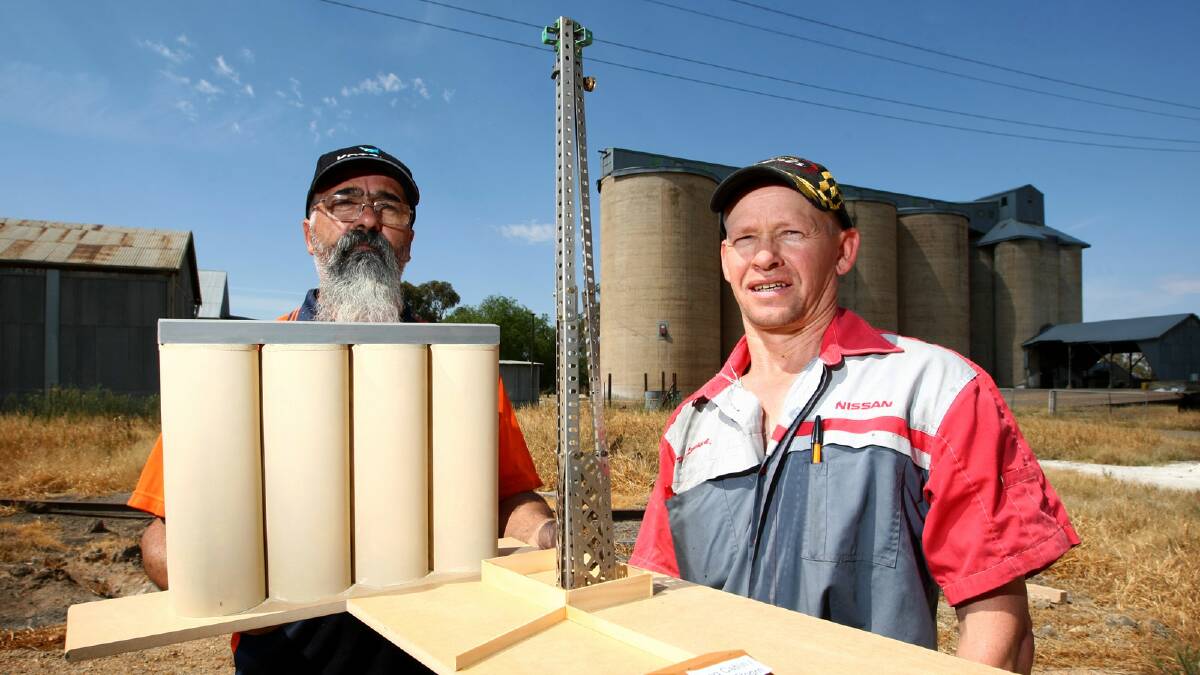 Paul Richards and Kim Lieschke with a scale model Mr Richards has built of the tower, which would be twice the height of the town’s silos and immediately adjacent to his home. Picture: MATTHEW SMITHWICK