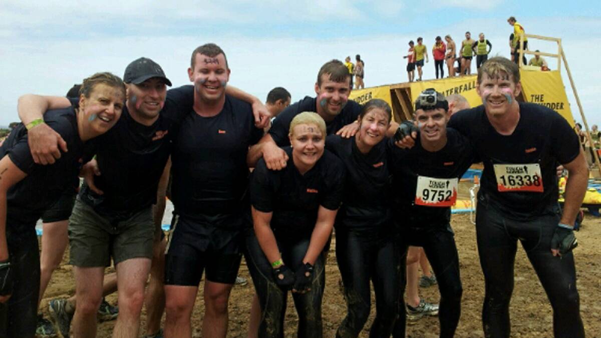 The Mudd Sweat and Beers team moments after completing the Walk The Plank challenge. Pictures: DAVID RIDLEY