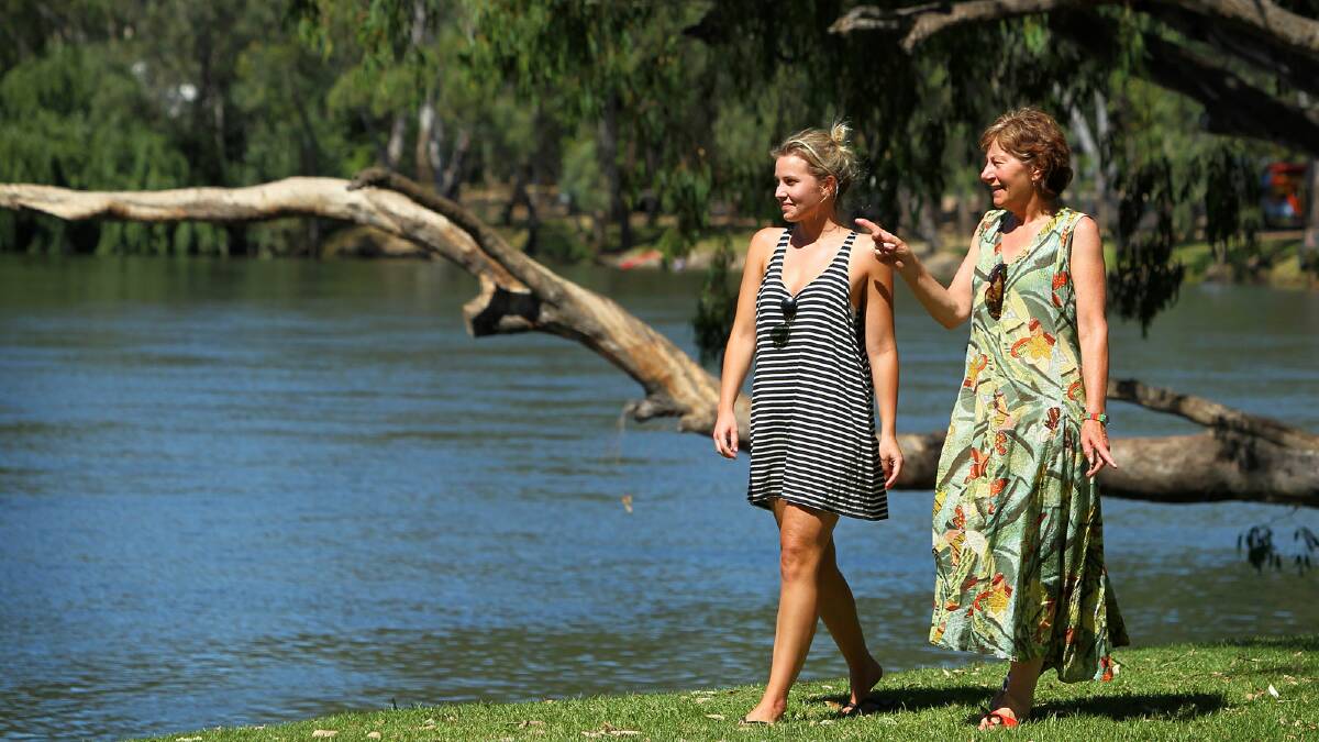 Emma McLear and Lynn Collishaw, of Wodonga, take a walk along the riverbank at Noreuil Park.