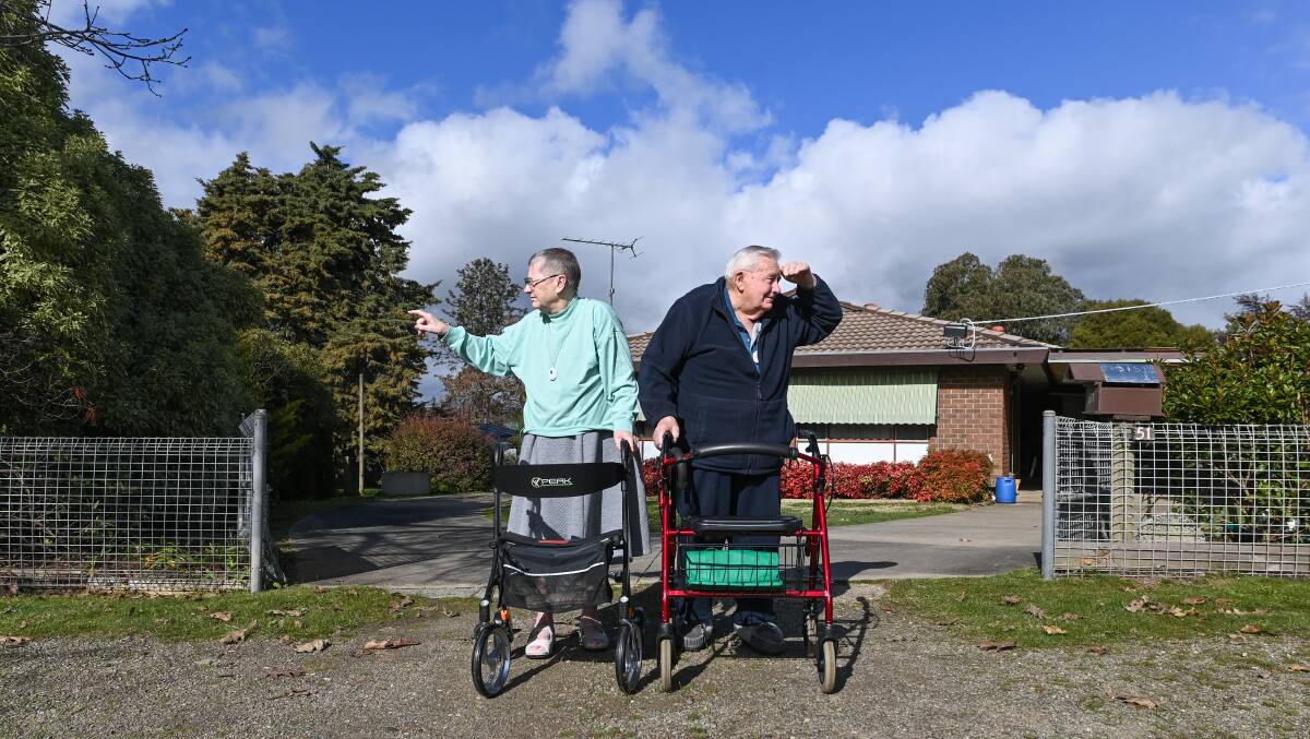 ON THE WRONG TRACK: Beechworth's Margaret Feeney and Mervyn Grosskopf say they need a proper footpath otherwise they can't leave their house. The pair say they were told they would need to wait five years for that footpath which they believe isn't good enough. Picture: MARK JESSER
