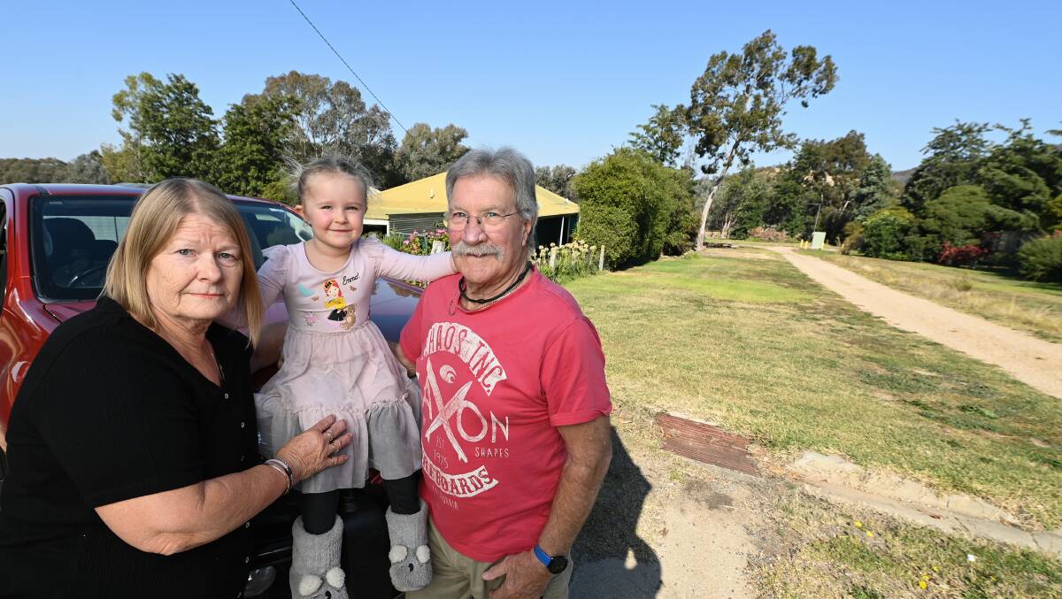 NO THANK YOU: Urve and Steve Fulton with their granddaughter Freya, say they don't want a bridge near their home on Thomas Street. 